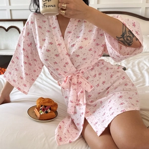 Pink floral cotton kimono robe for women with tie-waist in a cozy home setting
