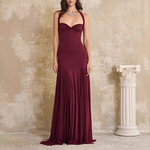 Detailed view of burgundy fishtail evening gown with mesh draping and sweetheart neckline