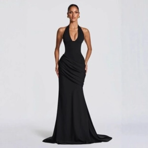Close-up detail of the waist draping and asymmetric pleats on this elegant black evening gown
