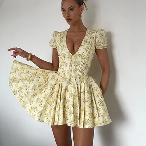 Yellow floral V-neck dress with puff sleeves and pleated skirt for summer style