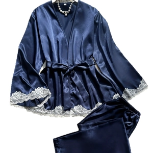 Women's navy blue satin pajama set with long sleeves and white lace trim detail