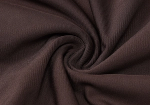 Texture dettagliata del tessuto a costine marrone scuro con design a pieghe a spirale