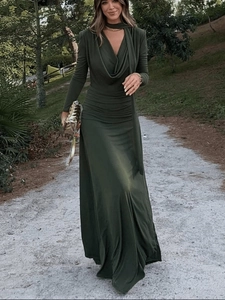 Detail of the gathered halter neckline and draped ruched waist on a green maxi dress