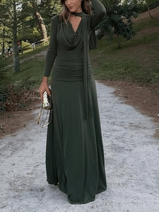 Detailed view of the dark green maxi dress featuring a chic cowl neck and waist ruching design