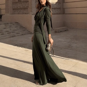 Deep olive green halter neck maxi dress with pleated waist and elegant draped silhouette