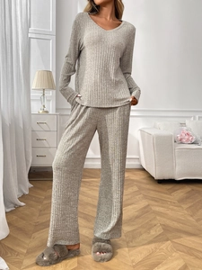 Detailed texture of grey ribbed knit loungewear set with V-neck top and wide pants
