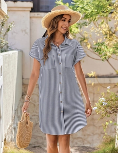 Close-up of blue striped cotton linen shirt dress with amber buttons and chest pockets