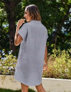 Detailed close-up of striped cotton-linen shirt dress featuring short sleeves and lapel