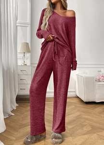 Detail of burgundy ribbed loungewear set featuring long sleeves and drawstring waistband