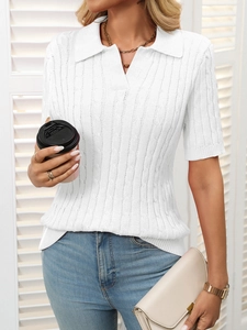 Detailed texture of white cable knit short sleeve polo sweater with V-neck collar