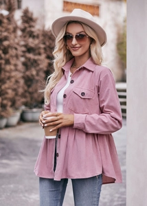 Detail of pink corduroy babydoll shirt showing the texture, collar, and brown buttons