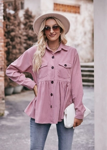 Detailed texture of pink corduroy fabric on a long sleeve peplum hem shacket for women