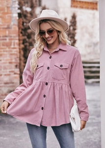 Detail of pink corduroy long sleeve shirt with chest pockets and peplum hem design