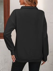 Back view of black oversized polo sweatshirt with ribbed cuffs and drop shoulder