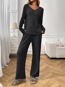 Detail of dark grey ribbed knit fabric on a V-neck long sleeve lounge set for women