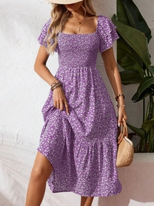 Detail of square neckline and smocked bodice on purple floral summer midi dress