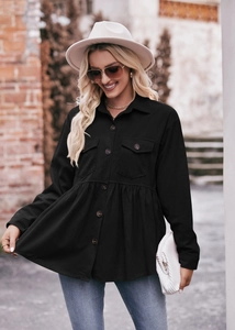 Close-up of black corduroy babydoll shirt with peplum hem and buttoned pockets