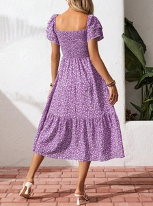 Detail view of the smocked elastic back on this floral puff sleeve lavender midi dress