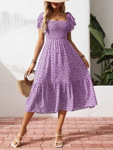 Close-up of smocked bodice and square neck on floral puff sleeve midi summer dress