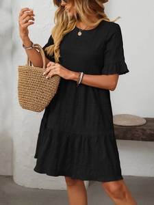 Detail of ruffled sleeves and tiered pleats on black casual loose flowy summer dress