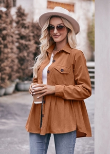 Detail of caramel corduroy babydoll shirt showing vertical ribbed texture and button closure
