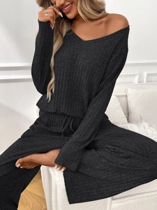 Detail of ribbed knit texture on dark grey loungewear set with drawstring waist