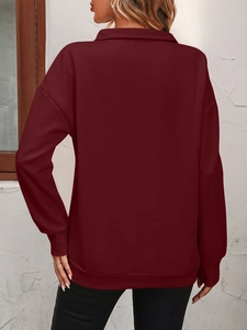 Back view of burgundy half-zip sweatshirt featuring ribbed cuffs and dropped shoulders