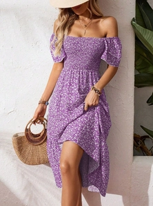 Detail of smocked bodice and puff sleeves on floral purple summer maxi dress