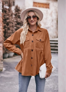 Detail of caramel corduroy babydoll shirt showing front buttons and chest pockets