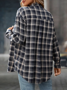 Back view of a casual loose plaid shirt for women in blue and black pattern