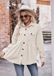 Detailed texture of beige corduroy blouse featuring a peplum hem and chest flap pockets