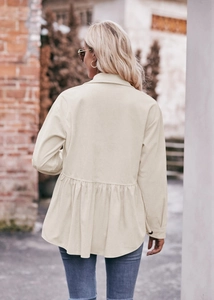 Detail view of cream corduroy babydoll jacket featuring elegant rear ruffle hem design