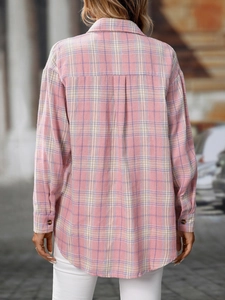 Detail of a casual plaid shirt back featuring pink and purple patterns with center pleat