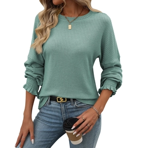 Sage green ribbed knit long sleeve T-shirt with ruffle cuffs and a casual crew neck