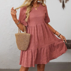 Dusty rose smocked tiered dress with ruffle sleeves and a flowing three-layer skirt