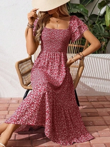 Detail of red floral maxi dress showing smocked square neck and ruffled short sleeves