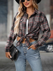 Detail of red and grey plaid shirt featuring soft brushed texture and classic button-up collar