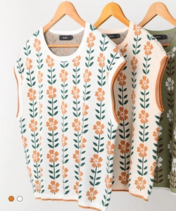 Close-up of knit crop tops with delicate floral patterns and round neck details