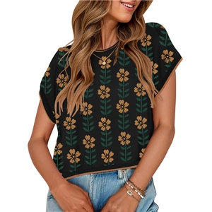 Knit crop top with sunflower pattern, cap sleeves and contrasting yellow trim on white backdrop
