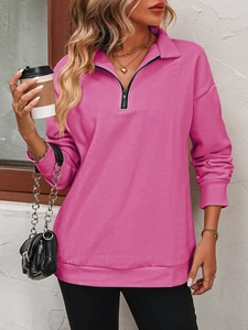 Detail of rose red half-zip fleece sweatshirt with ribbed cuffs on fashion model