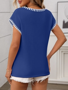 Detail of royal blue sleeveless knit top with striped hem and back view fit