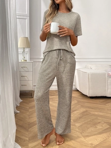 Close-up of grey ribbed loungewear set featuring soft fabric texture and drawstring waist