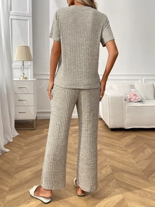 Detail view of the soft ribbed texture on this two-piece lounge set with wide-leg pants