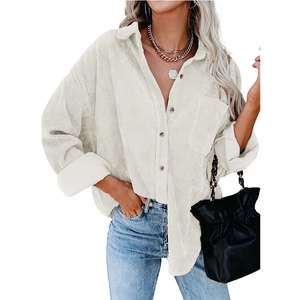 Women's oversized white corduroy shirt featuring a button-down collar and chest pocket