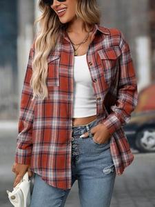 Detail of red and blue plaid flannel shirt with flap pockets and button-down front design
