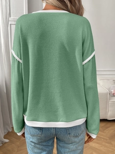 Back view of mint green knit sweater with white contrast piping and drop shoulders
