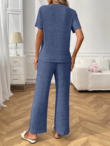 Rear view of blue ribbed knit loungewear set with short sleeve top and wide leg pants