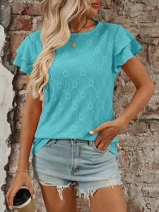 Detail of teal knit top featuring hollow-out diamond texture and double ruffle sleeves