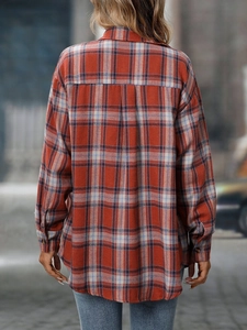 Detailed back view of casual plaid shirt with inverted pleat and classic tartan pattern