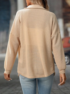 Detailed waffle texture on a casual loose fit long sleeve lapel shirt in apricot color